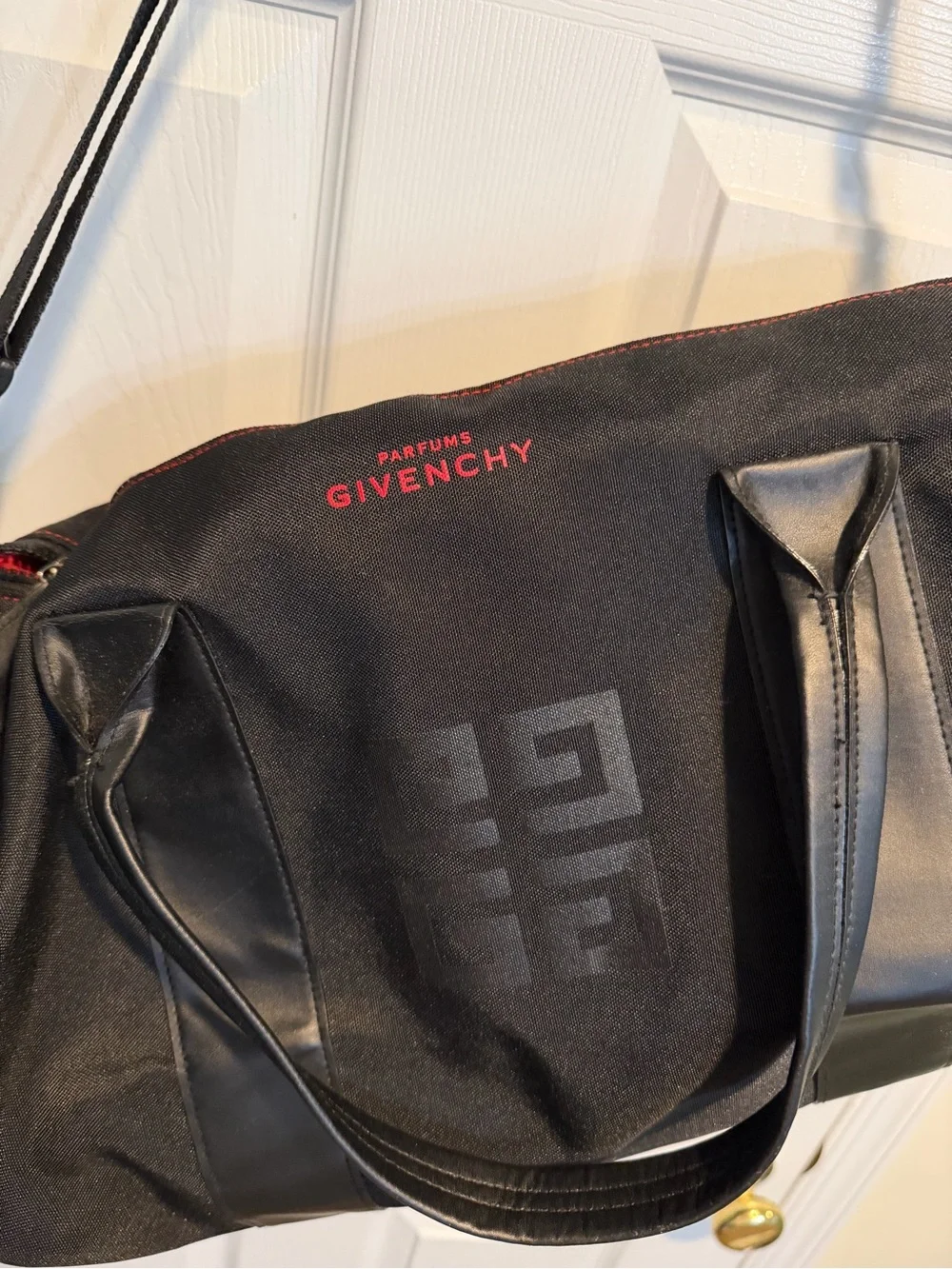 Givenchy Parfums Black Duffel Bag with Red Shoulder Pad